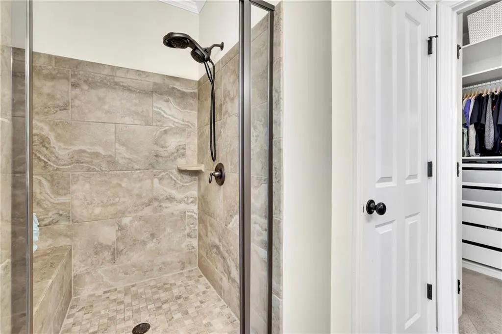 Full bath with a shower stall and a spacious closet Full bath with a shower stall and a spacious closet