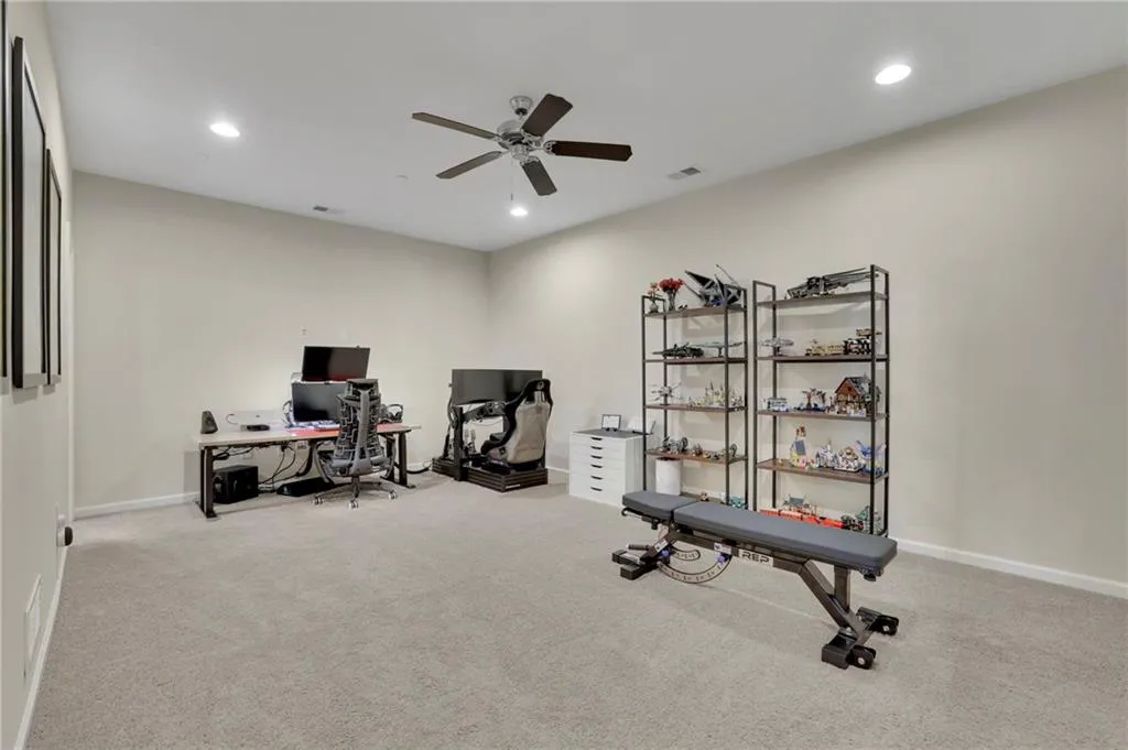 Exercise area featuring recessed lighting, carpet, and ceiling fan Exercise area featuring recessed lighting, carpet, and ceiling fan