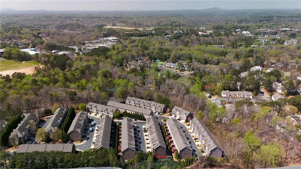 Birds eye view of property with a wooded view Birds eye view of property with a wooded view