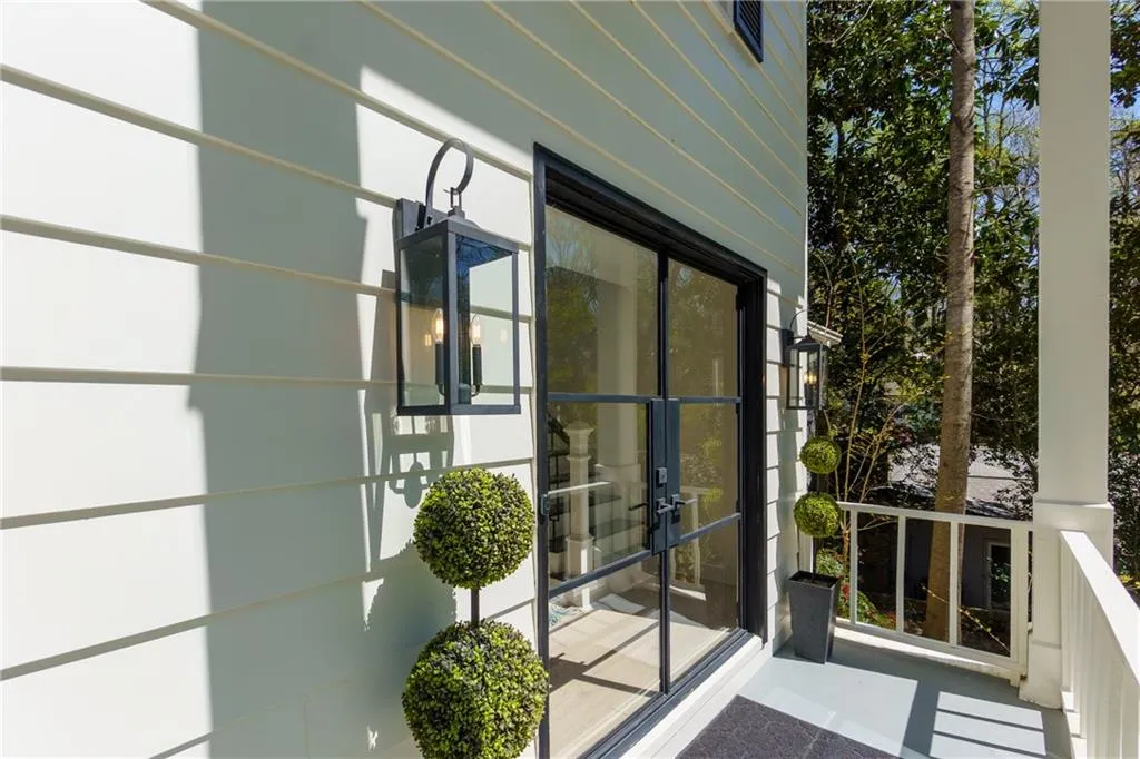 Property entrance featuring custom iron doors