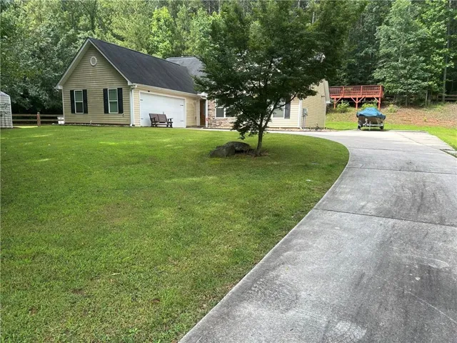 View of front facade featuring concrete driveway