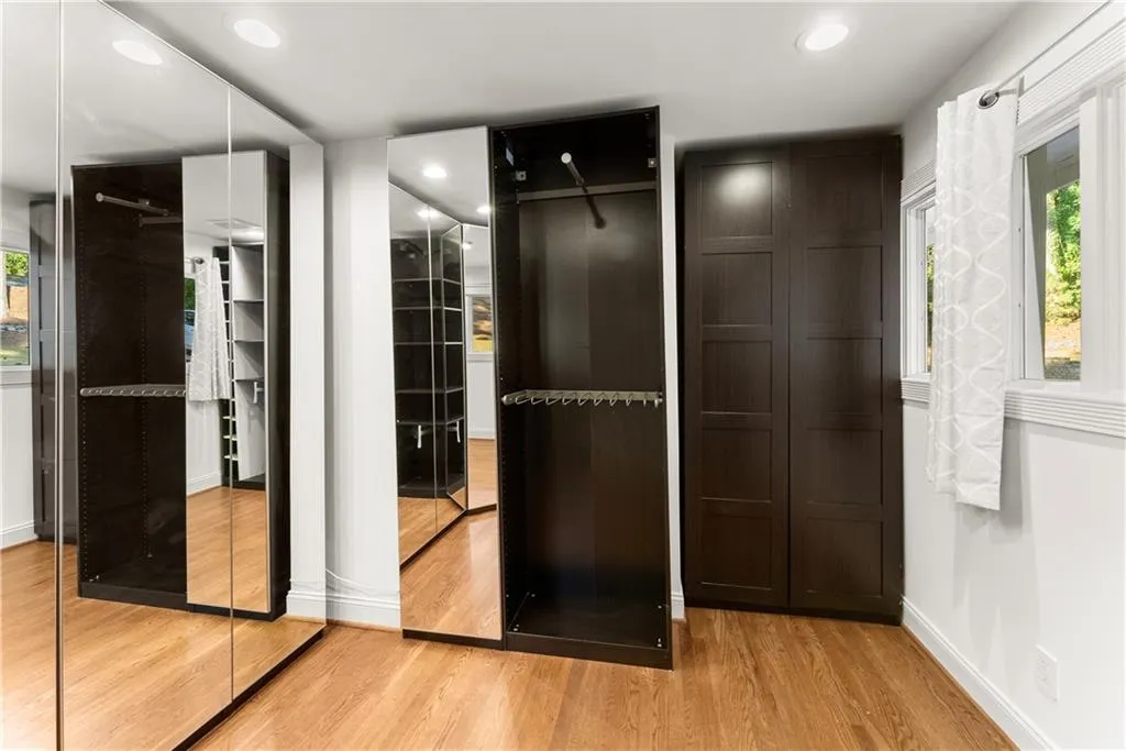Walk in closet featuring light wood-type flooring