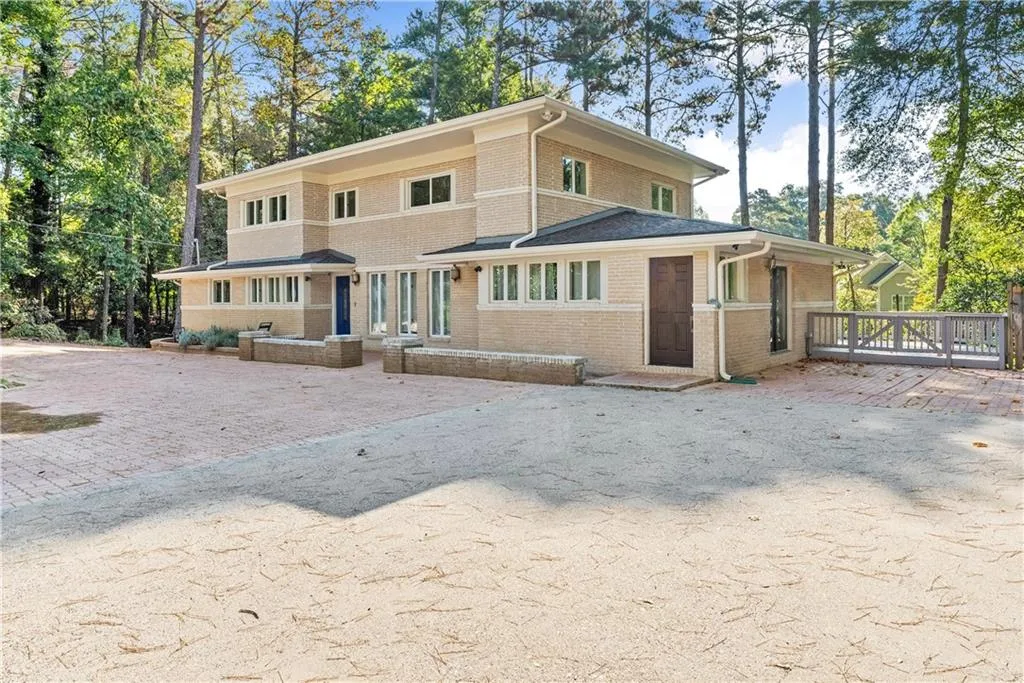 View of front of house featuring brick siding