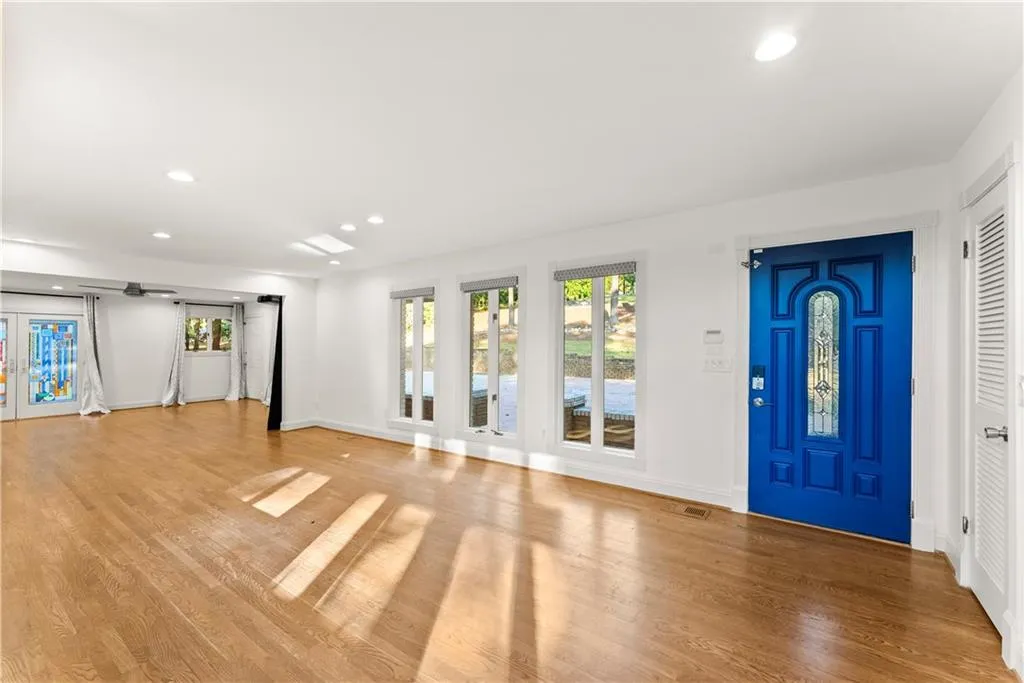 Entryway with recessed lighting, french doors, and light wood-style flooring