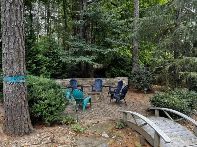 View of pool with a playground, a fenced backyard