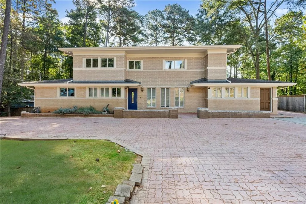 Prairie-style home with brick siding