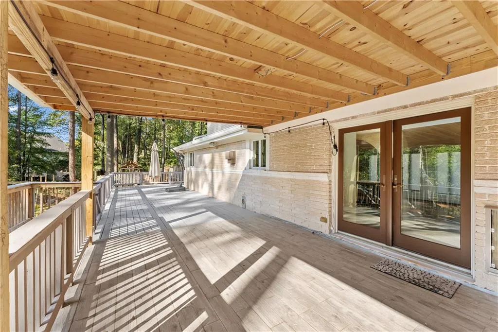 Deck featuring view of scattered trees