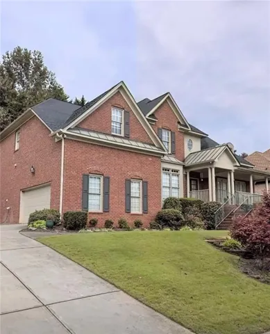 Brick exterior with contrasting dark shutters