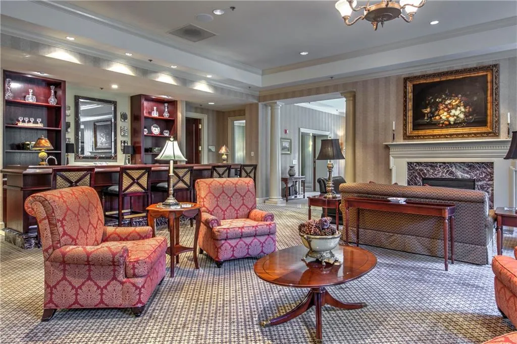 Club Room located on the second floor with cozy fireplace and extensive bar seating and gathering areas