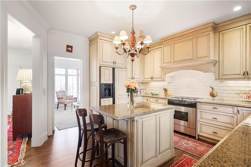 Custom cabinetry, gas range and island.