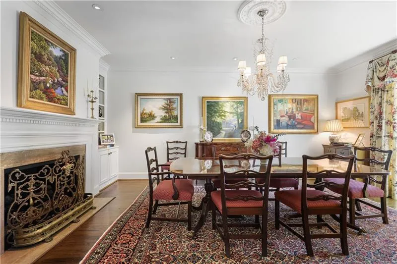 Large dining room with fireplace and room for 12+.