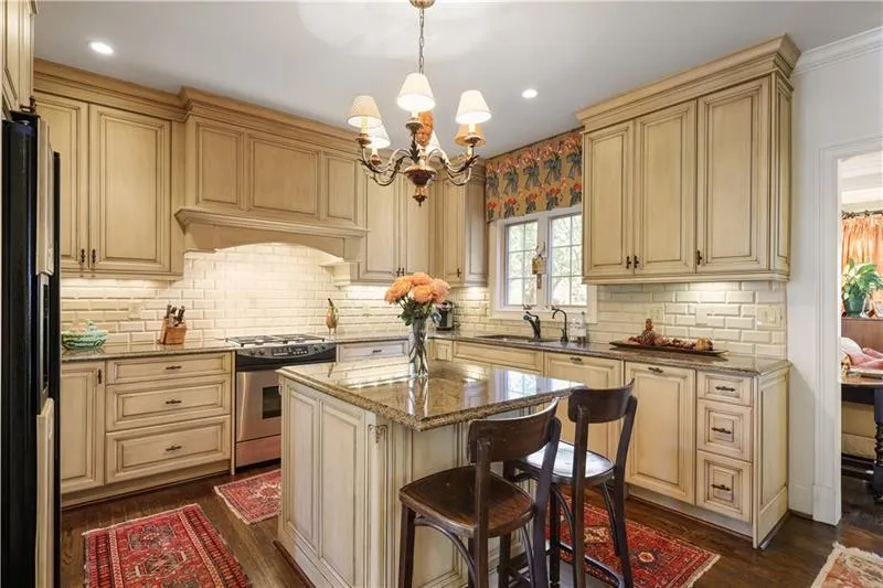Kitchen has a view to the den.