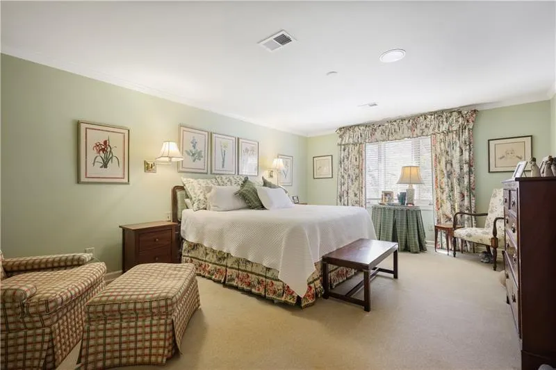 Large primary bedroom with sitting areas.
