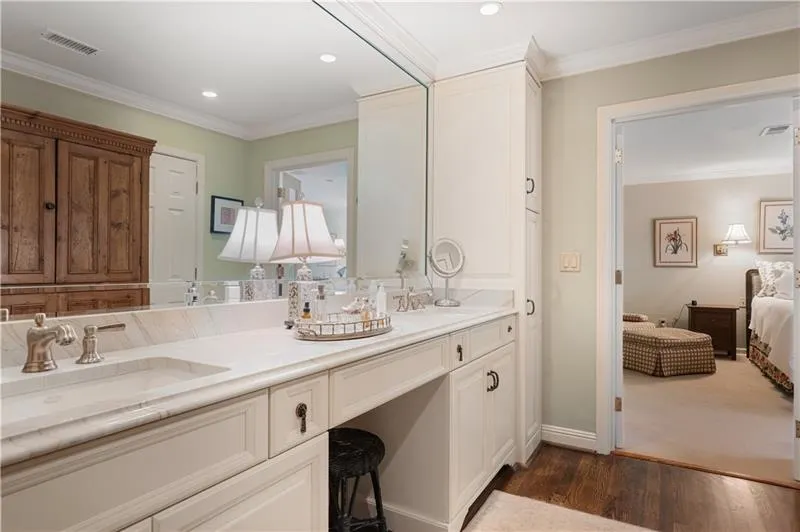 Double vanities and his and her closets.