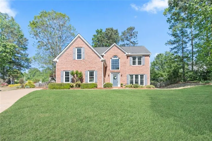 Classic curb appeal in a sidewalk-lined community in the Lanier High School district