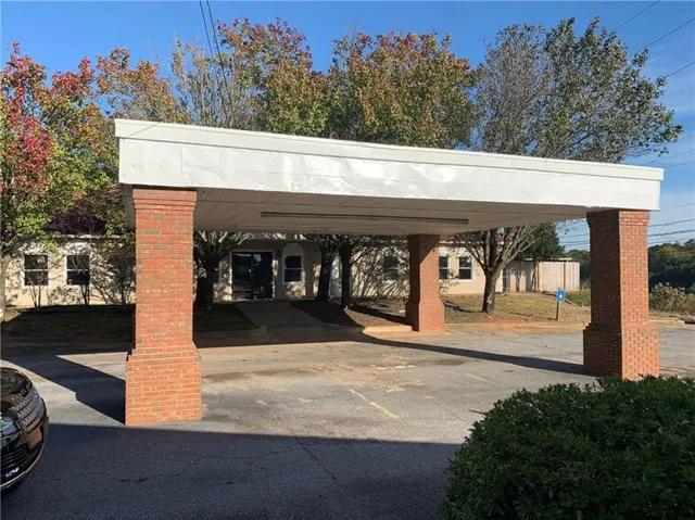 View of property's community featuring a detached carport