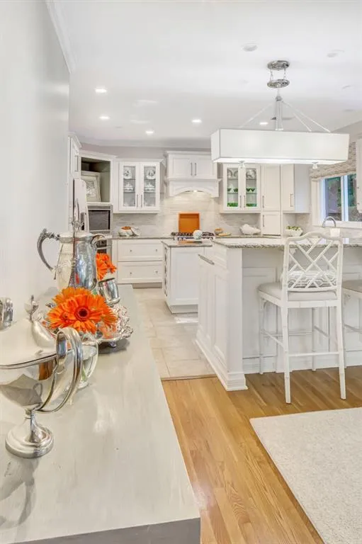 Living Room open to Kitchen and backyard with stone patio