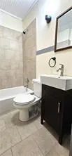 Full bathroom with vanity and tub / shower combination