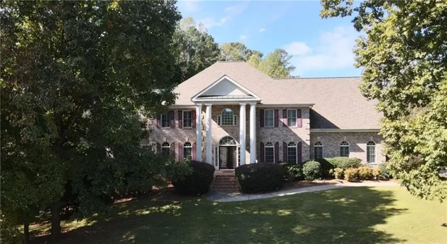Neoclassical home with a front yard