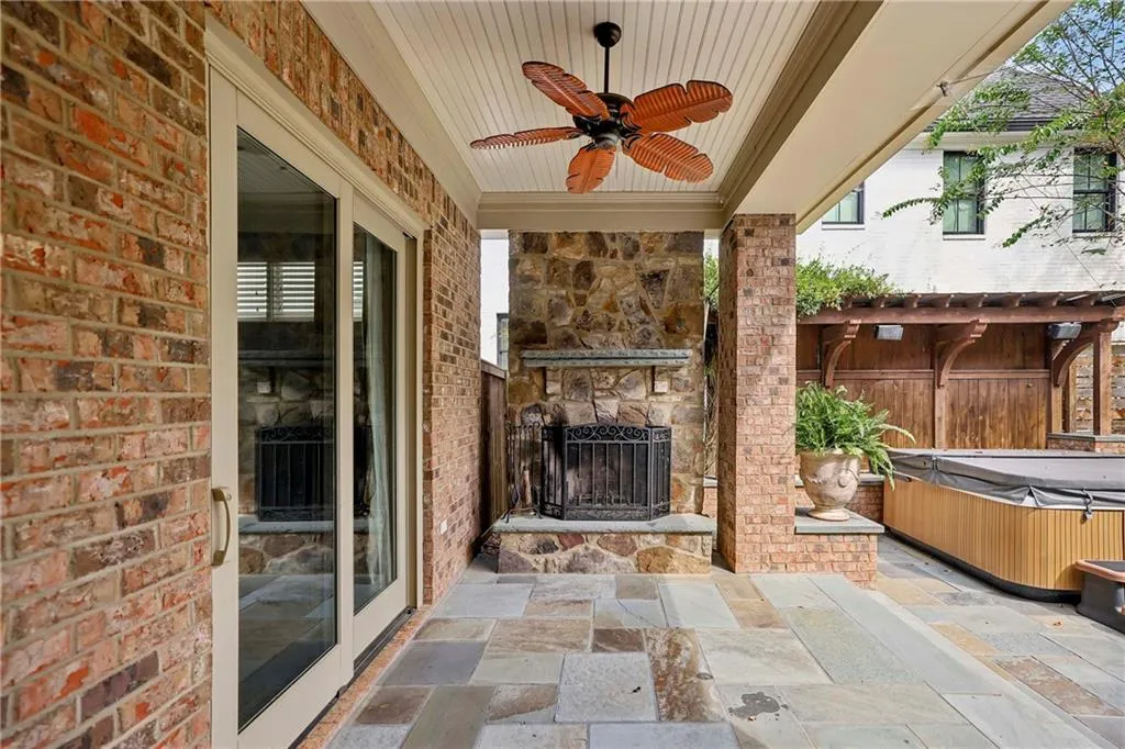 Covered patio with fireplace.