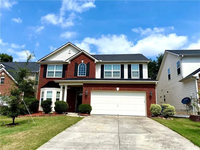 Brick and siding exterior with a two-car garage