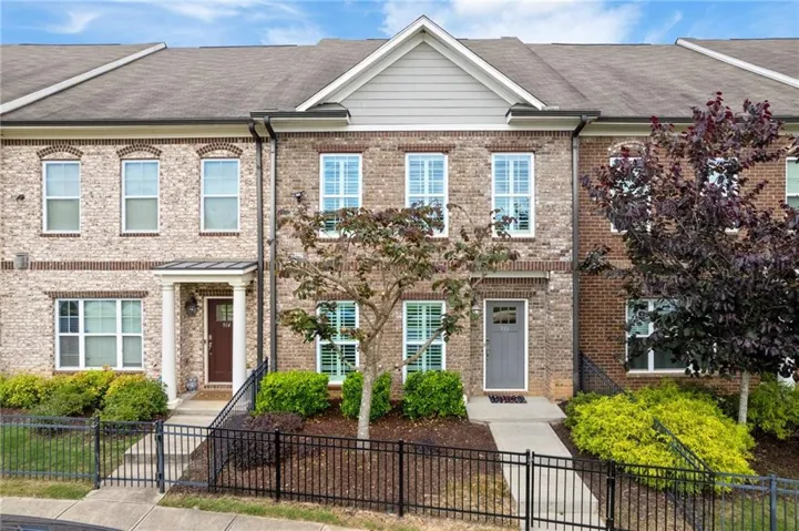Home with a nice fenced courtyard area.