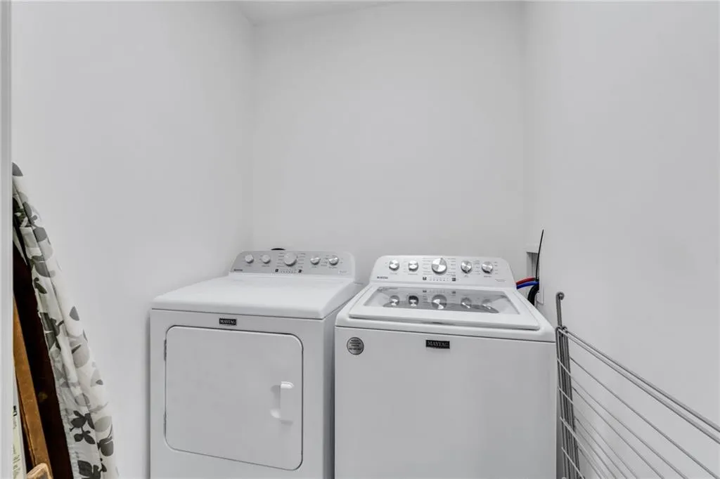The laundry room is off of the kitchen area.