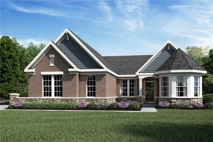 Brick exterior featuring a stone foundation and contrasting blue siding gables