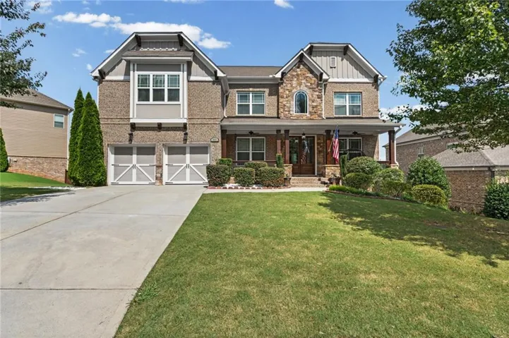 Brick and stone façade with an inviting covered porch