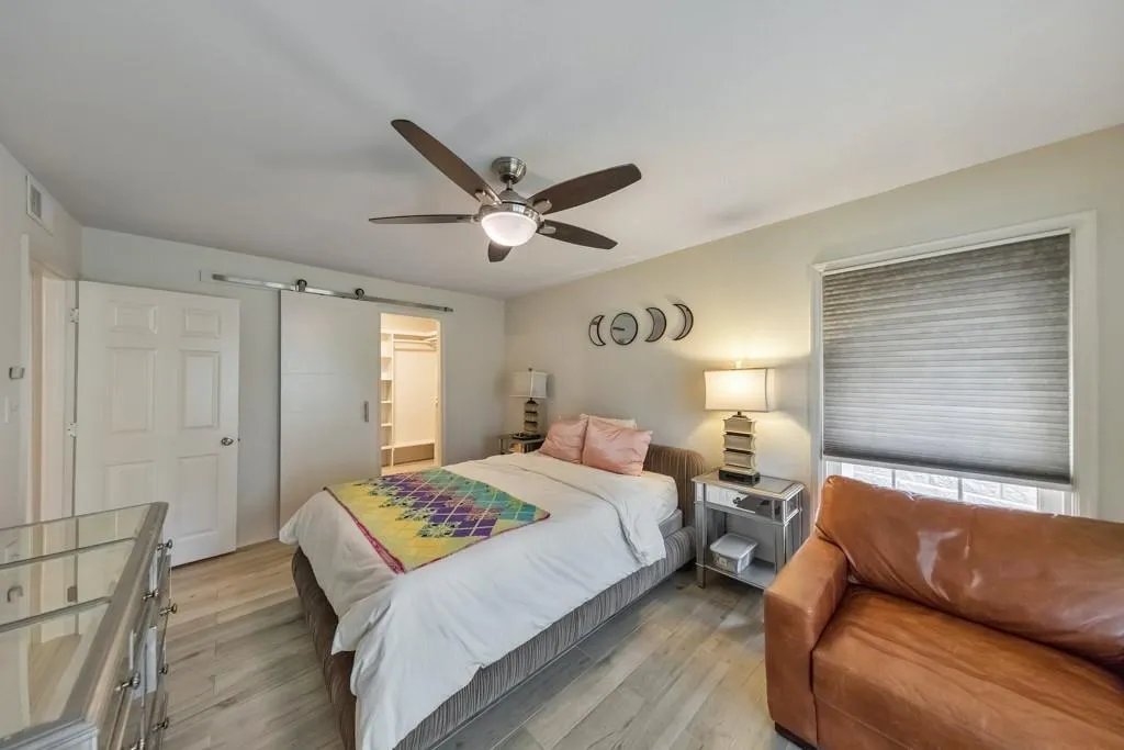 ANOTHER VIEW OF PRIMARY BEDROOM WITH BARN DOOR STYLE WALK IN CLOSET!