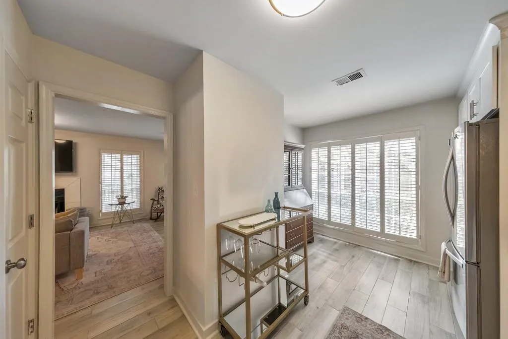 ANOTHER VIEW OF KITCHEN LEADING TO SITTING AREA AND DEN!