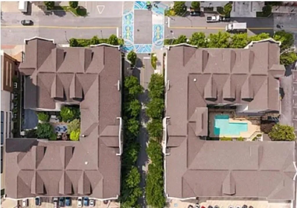Aerial overview of property's location featuring a pool area