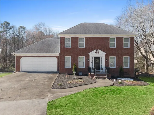 Two-story brick residence with an attached two-car garage