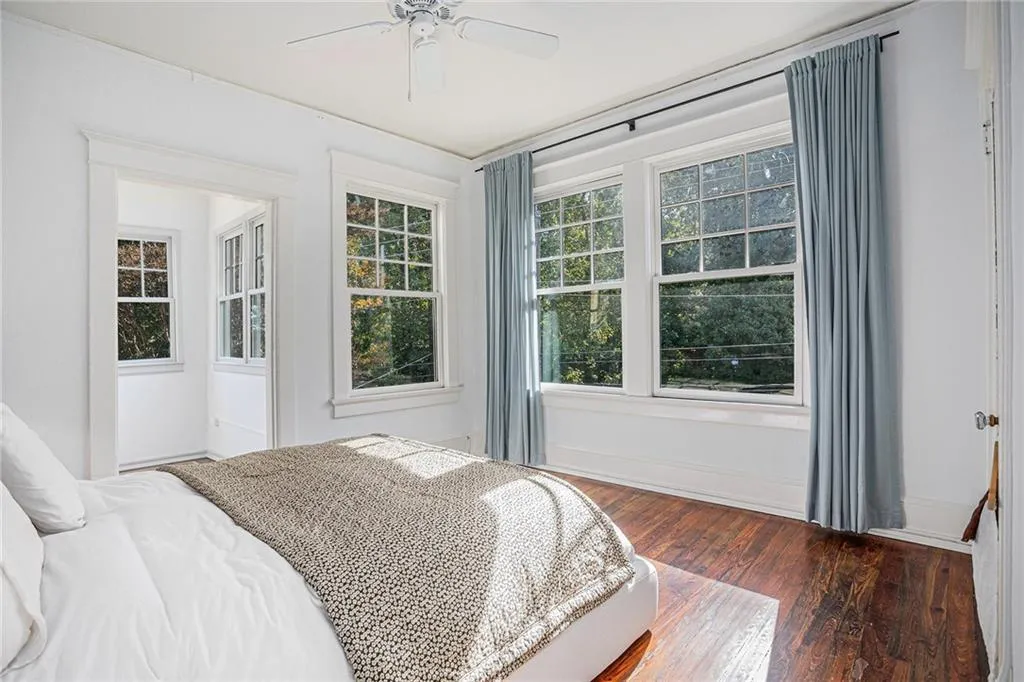Bedroom featuring dark hardwood / wood-style floors and ceiling fan