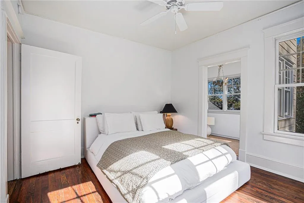 Bedroom featuring dark wood-type flooring and ceiling fan