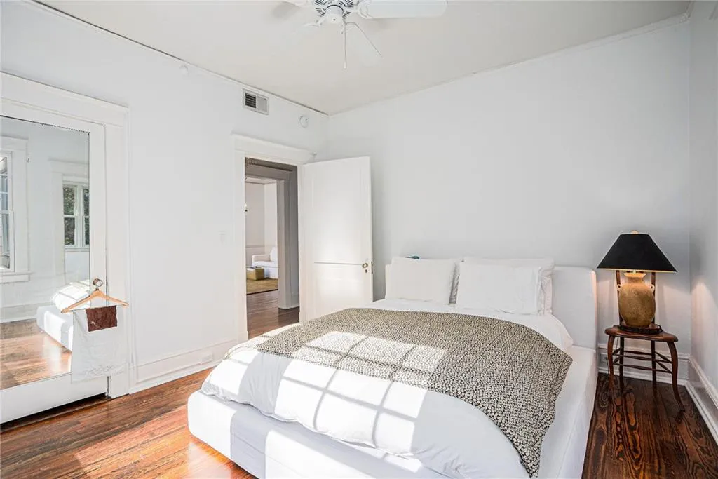 Bedroom with wood-type flooring and ceiling fan