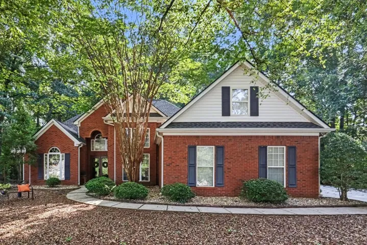 Classic Brick Traditional with Owner's Suite on Main in the desirable Wentworth At White Oak Community!