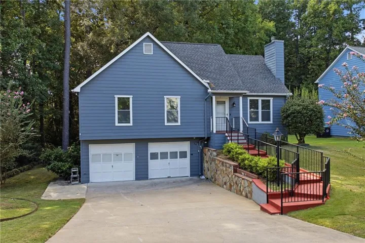 Blue siding exterior with white trim