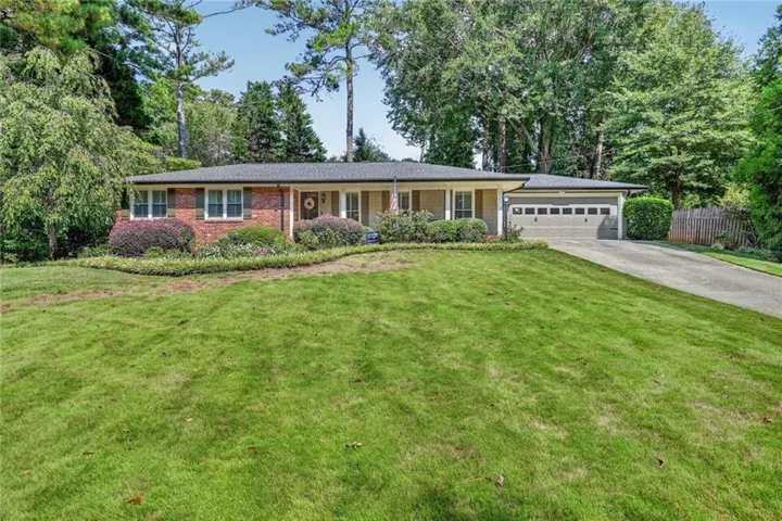 Brick and siding exterior with a two-car garage