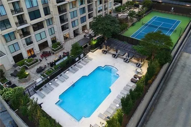 Community pool with a patio