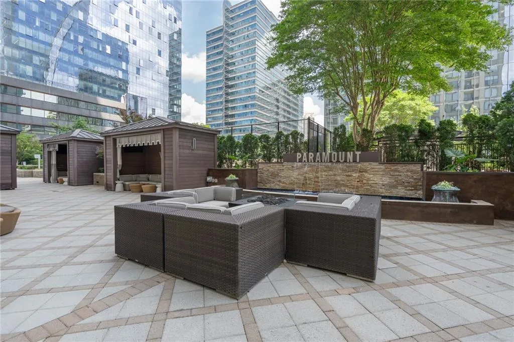 View of patio with an outdoor living space, a view of city, and an outdoor structure