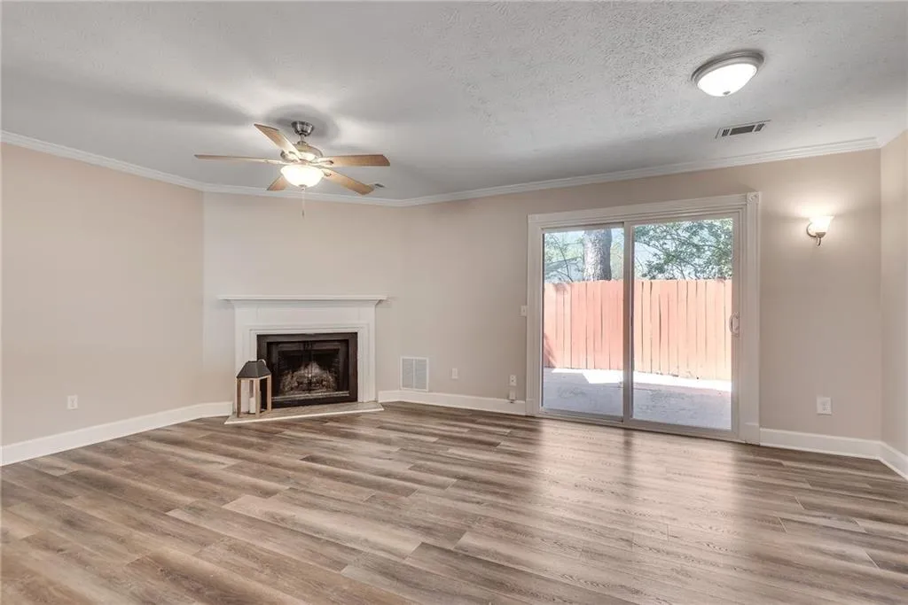 The kitchen opens into the spacious fireside family room/dining area, which is the perfect spot for winding down after a long day at work. The kitchen opens into the spacious fireside family room/dining area, which is the perfect spot for winding down after a long day at work.