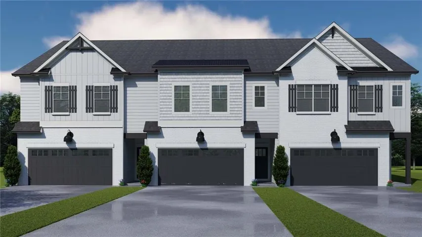 Modern multi-family dwelling featuring a dark shingled roof, white siding, black window shutters, and integrated garage doors