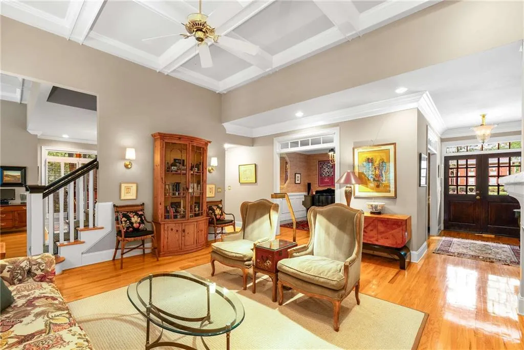Rich details abound with wood and gas fireplaces, custom upgraded molding and wainscotting, coffered and tray ceilings, beautiful solid oak wood floors on main, custom wood interior shutters, recessed lighting, and solid wood interior doors