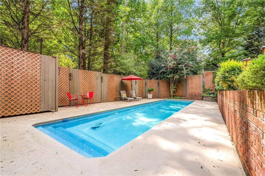 Extended multi-level brick patio and pool area is an entertainer’s dream