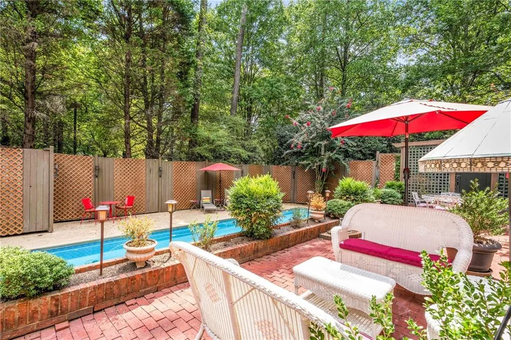 Extended multi-level brick patio and pool area is an entertainer’s dream