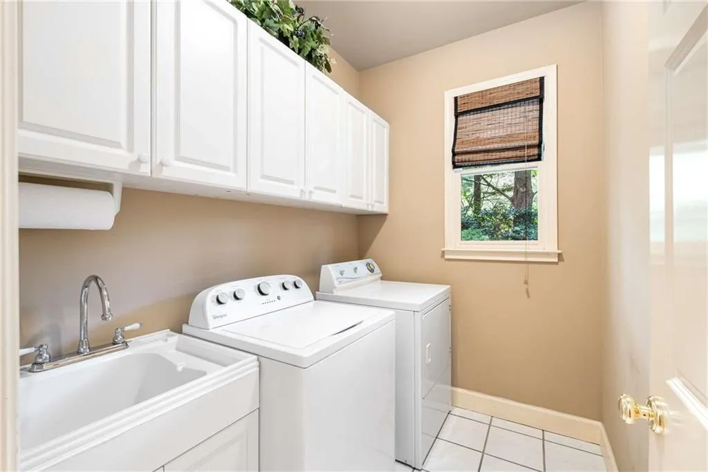 Powder room and laundry room with sink round out the main floor