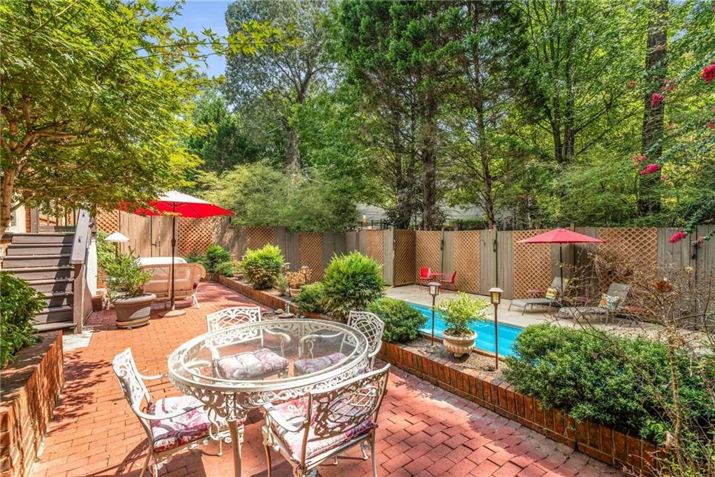Extended multi-level brick patio and pool area is an entertainer’s dream