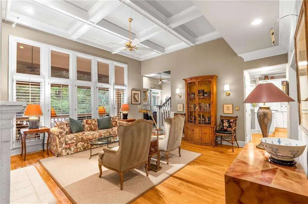 Rich details abound with wood and gas fireplaces, custom upgraded molding and wainscotting, coffered and tray ceilings, beautiful solid oak wood floors on main, custom wood interior shutters, recessed lighting, and solid wood interior doors