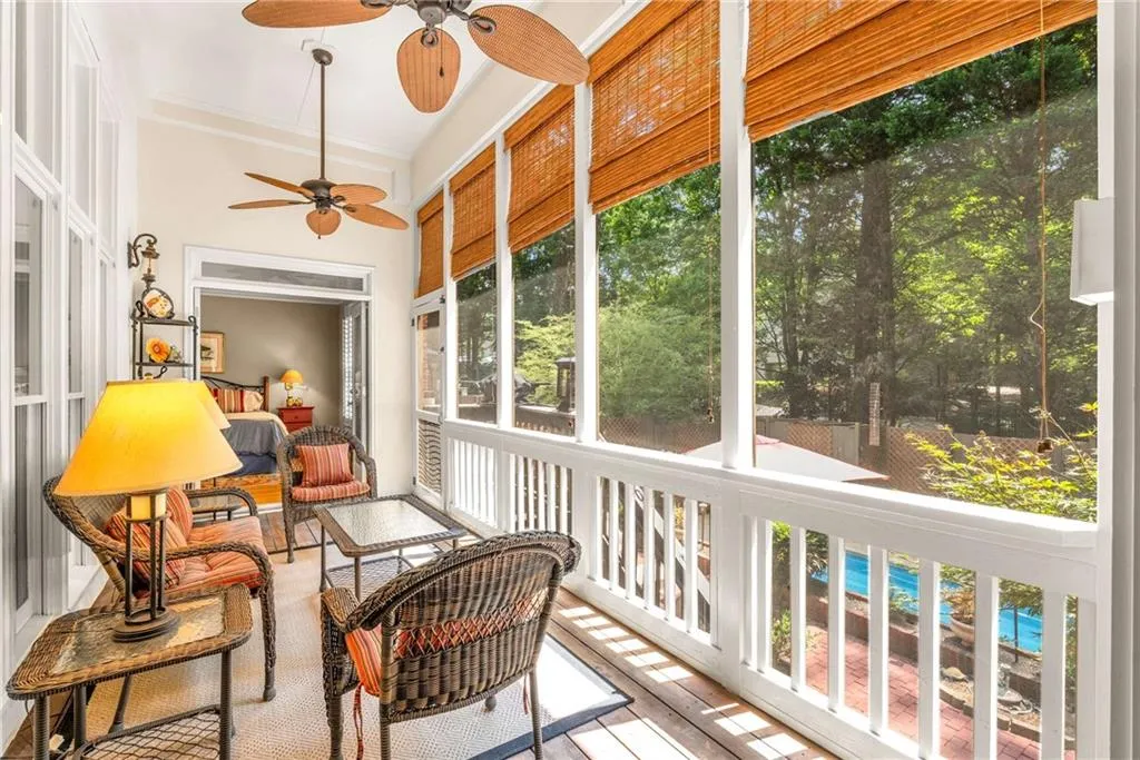 Screen porch overlooks the courtyard back yard and the pool